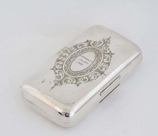 A silver plate cigar box engraved E W Parrott Jan 29thC: A silver plate cigar box engraved E W Parrott Jan 29thC 1925. 5 1/2'' x 1 1/4'' x 3''