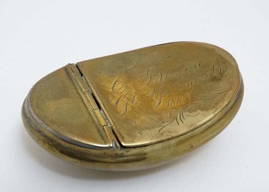 Victorian Snuff Box : a brass ovoid and hip shaped ,: Victorian Snuff Box : a brass ovoid and hip shaped , hinge lidded pocket snuff box signed ' C. Bacon , Gt. Yarmouth 1883 ' , 3 '' long.