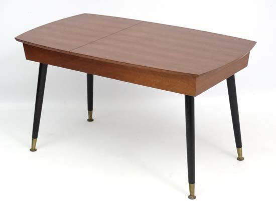 Vintage Retro : a British Teak low floor standing: Vintage Retro : a British Teak low floor standing cutlery cabinet containing a full set of Viners cutlery in the Gerald Benney manner, the shaped cabinet 33 1/3 x 19 3/4 x 18 1/2'' high.