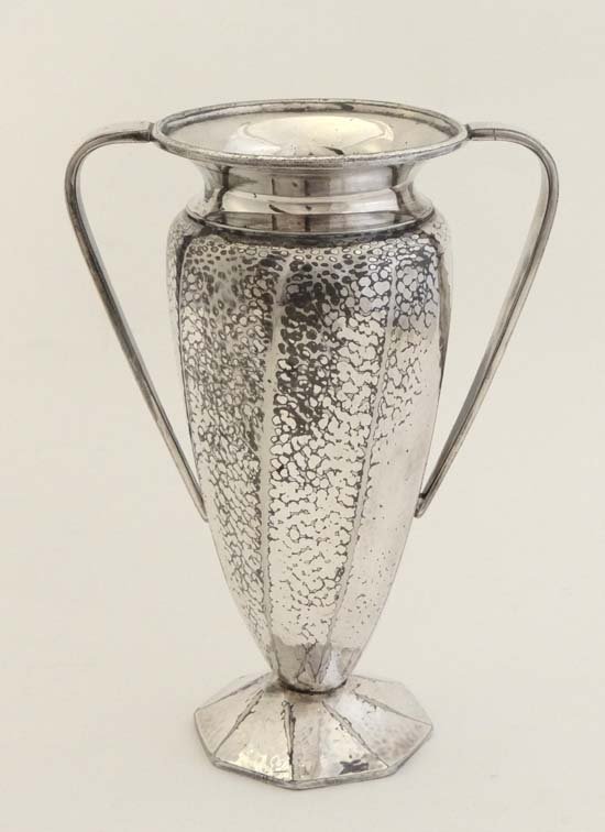 James Dixons & Son : A silver plated twin handled case: James Dixons & Son : A silver plated twin handled case with hammered decoration. Marked under James Dixon & Sons Sheffield Cornish Pewter W1877 9'' high