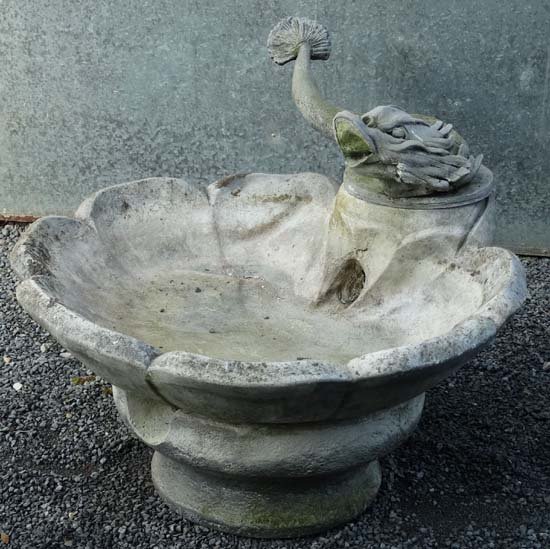 Garden & Architectural : water fountain, a late 20thC: Garden & Architectural : water fountain, a late 20thC re-constituted stone and fibreglass scallop shell shaped reservoir with classical fish to top ( formerly a water fountain), 36'' wide