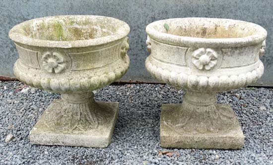 Garden & Architectural : A pair pedestal urns made of: Garden & Architectural : A pair pedestal urns made of re-constituted stone with gadrooned lower sides. 14 1/2'' high (2)