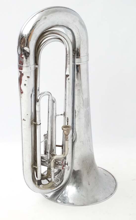 Musical Instruments : A ' Dynasty II ' marching Tuba by: Musical Instruments : A ' Dynasty II ' marching Tuba by DEG Products , New Geneva , Wisconsin USA . Chrome finish overall . Approximately 38'' tall