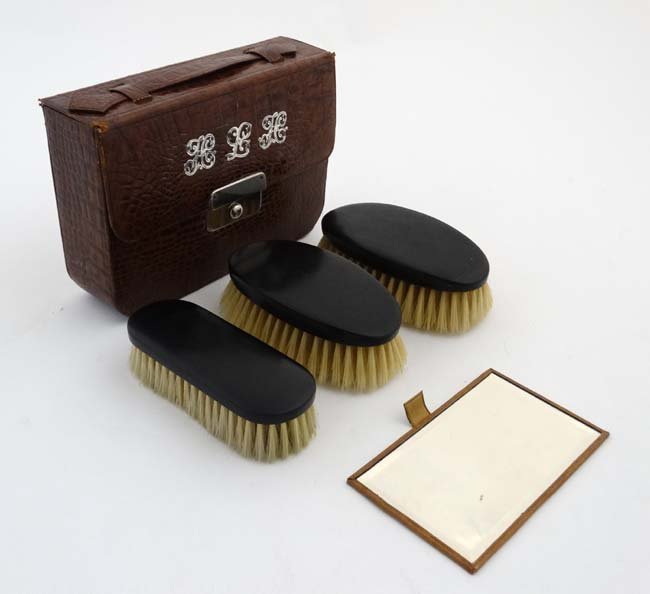 A Crocodile skin and leather cased brush set with (1 of 7)