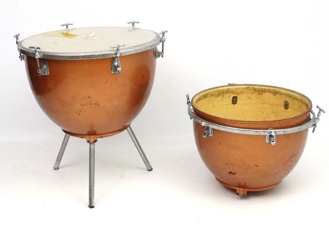 Musical Instruments : A pair of mid - 20thC Kettle: Musical Instruments : A pair of mid - 20thC Kettle Drums , of domed fibreglass construction with copper - coloured metallic finish . Marked ' BS3499 Made in England ' underside . The drum bodies appro