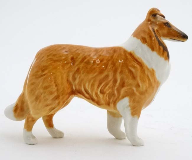 A Beswick model formed as a Collie Dog, number 1814 ,: A Beswick model formed as a Collie Dog, number 1814 , in gloss finish, bears factory stamp under. 3 1/2'' high.