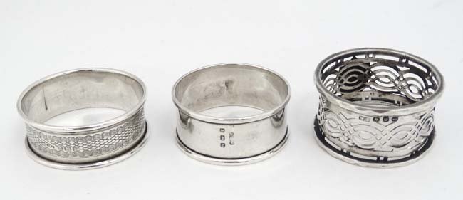 3 various silver napkin rings 1 x Birmingham 1930: 3 various silver napkin rings 1 x Birmingham 1930 maker E.S Barnsley & Co., 1 x Birmingham 1896 maker William Devenport and 1 x Birmingham 1920 maker John Thompson & Sons (3) (40g)
