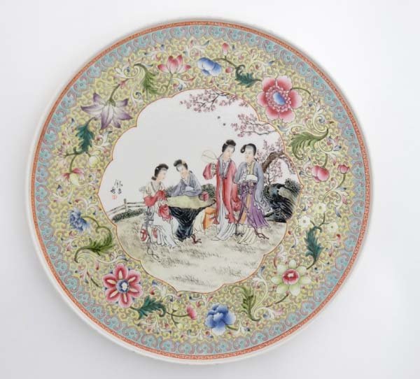 A 20thC Chinese famille rose charger , decorated in (1 of 4)