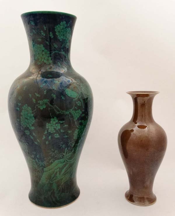 Two Chinese vases.  A large green and black vase with (1 of 10)