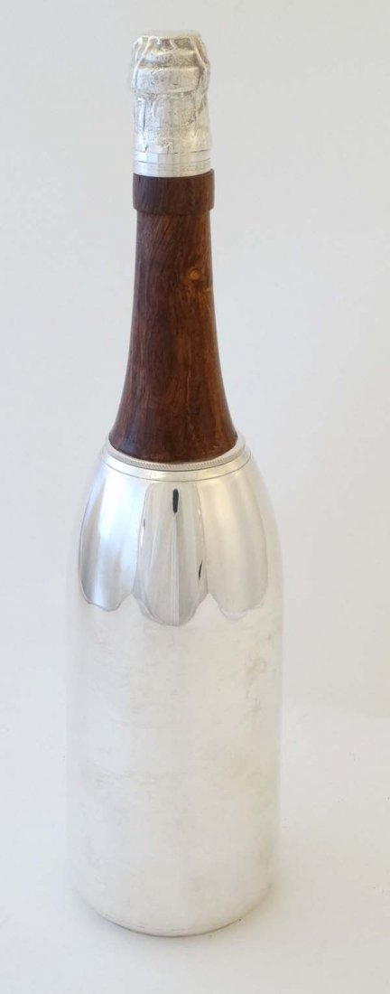 A 21stC  silver plate novelty cocktail shaker formed as (1 of 4)