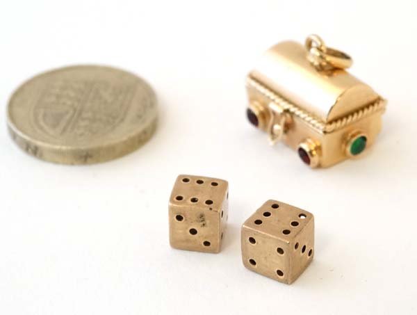 A yellow metal pendant  / charm formed as a miniature (1 of 3)