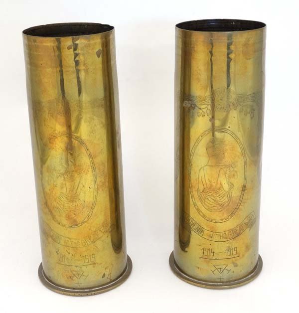 Militaria : Two WWI Trenchart German artillery shells ,: Militaria : Two WWI Trenchart German artillery shells , each decorated with Romanesque figures within ovals , ' Souvenir of the Great War 1914 - 1919 . ' Headstamps identify the cases as originating f