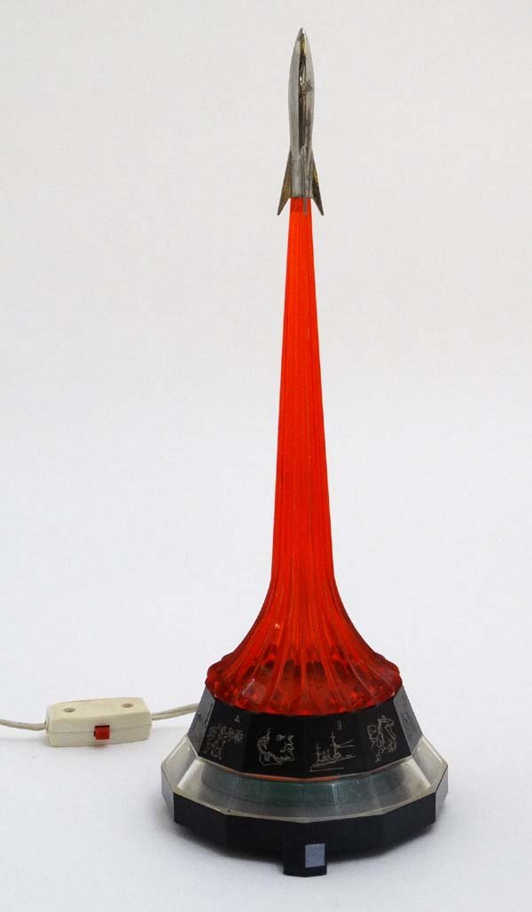Russian Space Race Lamp :A Russian c.1968 Space Race: Russian Space Race Lamp :A Russian c.1968 Space Race table lamp in the form of a coloured base having Soviet pictorial propaganda pictures to sides, Lenin 1917 revolution, Working the land etc. surmou