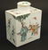 A Chinese famille rose tea caddy decorated in