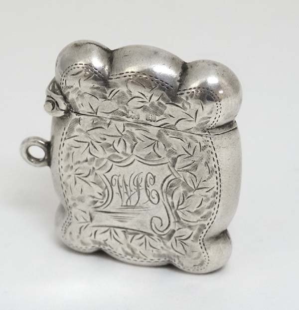 A small silver vesta case of shaped form with engraved: A small silver vesta case of shaped form with engraved decoration, hallmarked Birmingham 1905 maker William Hutton & Sons Ltd. 1 1/2'' high x 1 1/4'' wide