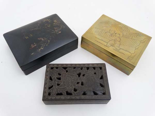A carved and pierced soapstone box together with a Hok: A carved and pierced soapstone box together with a Hok Hing & Co. Foochow China semi-domed lacquered lidded box and a brass cigarette box. Largest 4 1/4'' wide (3)