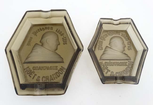 Advertising : 2 smoke glass ashtrays with intaglio: Advertising : 2 smoke glass ashtrays with intaglio decoration entitled ' Dom Perignon 1638-1715 Champagne Moet & Chandon' The largest 5 1/2''