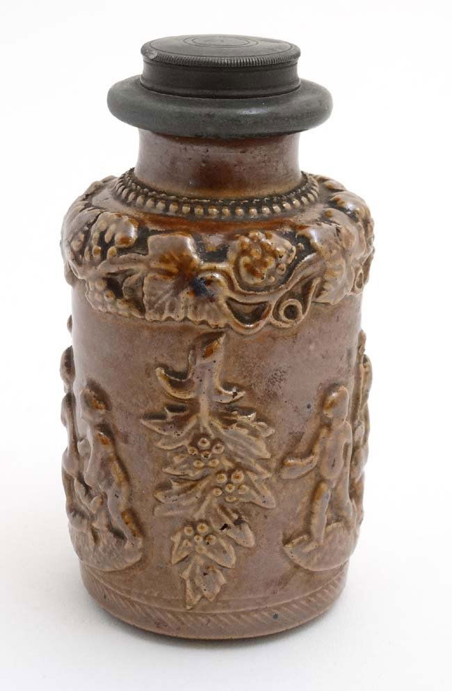 A Stoneware flask decorated with image of a young (1 of 4)