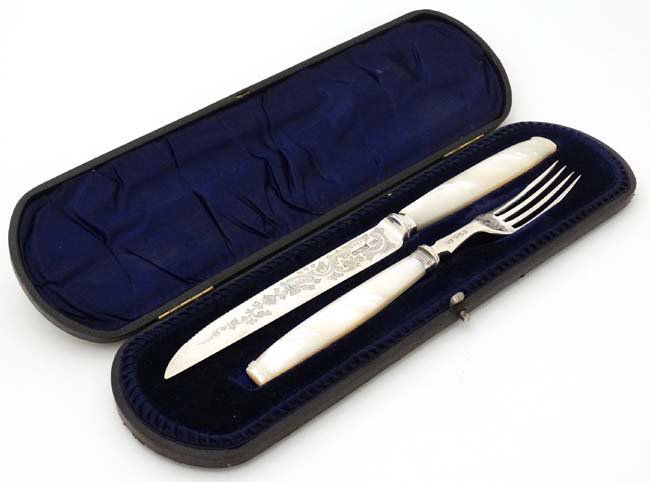 A cased silver serving knife and fork hallmarked (1 of 5)