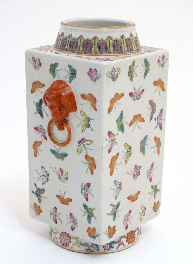 A Chinese famille rose ''Butterfly'' pattern twin: A Chinese famille rose ''Butterfly'' pattern twin handled kong case, decorated in poly chrome with an array of butterflies , the twin handles formed as elephants heads, bears red Chinese seal mark to