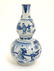 A Chinese blue and white double gourd vase decorated