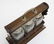 A late 19thC / early 20thC 3- bottle oak Tantalus with - 6