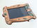 A 21stC photograph frame with embossed copper surround