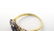 An 18ct gold ring set with central sapphire bordered by - 2