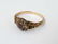 An 18ct gold ring set with central sapphire bordered by - 5