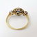 An 18ct gold ring set with central sapphire bordered by - 7