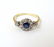 An 18ct gold ring set with central sapphire bordered by - 8