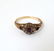 An 18ct gold ring set with central sapphire bordered by - 9