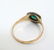 A 15ct gold ring set with central emerald bordered by - 5