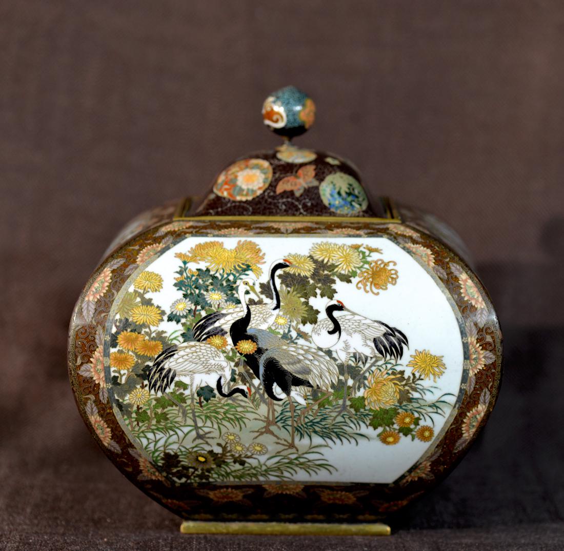 Stunning Japanese Cloisonne Koro Censer - Attribute to: 19th cen, meiji period, a square cloisonne koro censer with four reserved panel depecting butterfly, cranes and floral scene, extremely detailed work, the finial of the cover is partial repaired, body