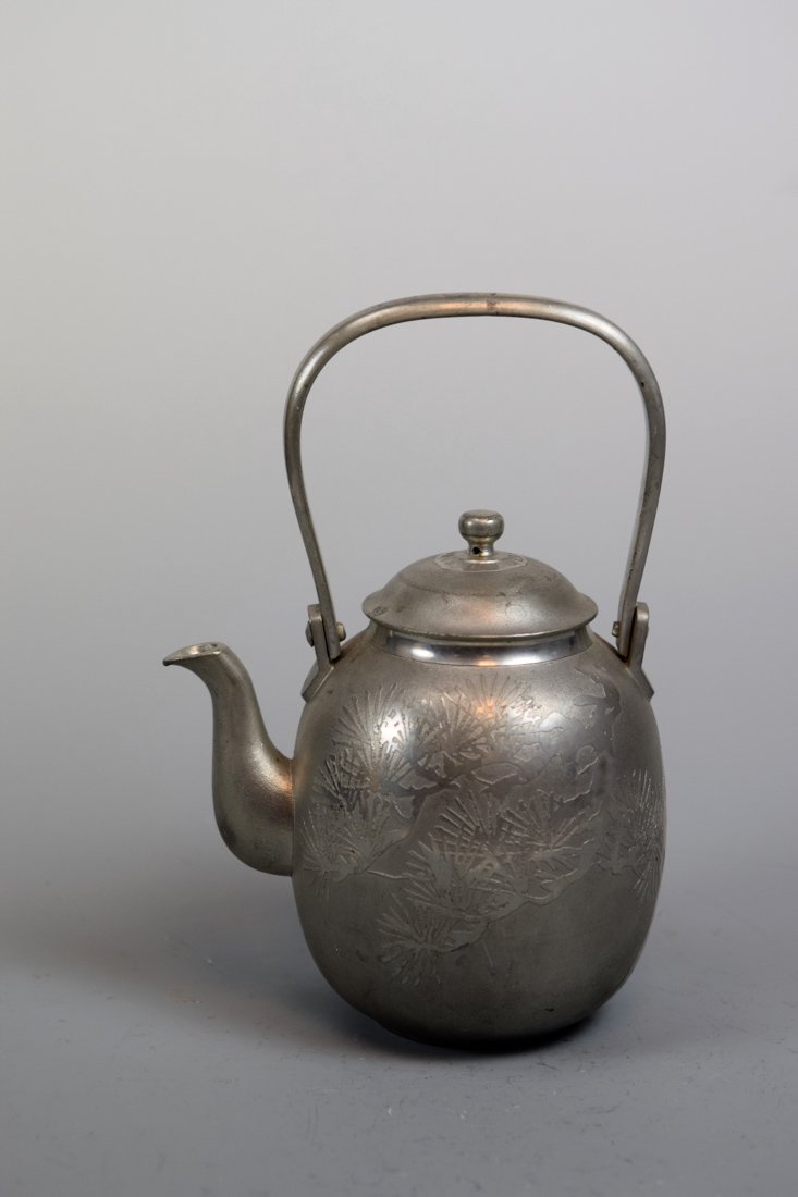 Japanese Pewter Teapot with Pine Motif: 19/20th cen, measures 7.5" in height, 5" wide, maker mark at bottom