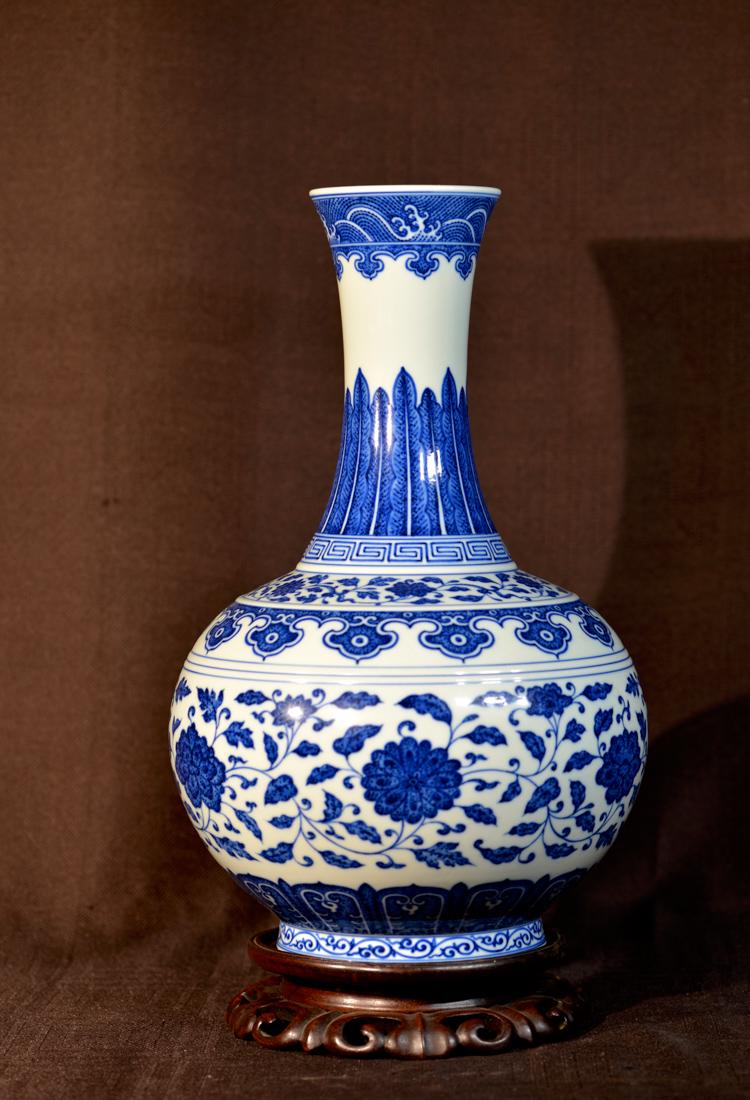 Chinese Blue White Porcelain Vase with Lotus: on rosewood stand, chinese blue white porcelain bottle shaped vase with mark, 1900's , measures 15.25" in height, with old collection lable; Provenace: from a Northeast Maine Estate