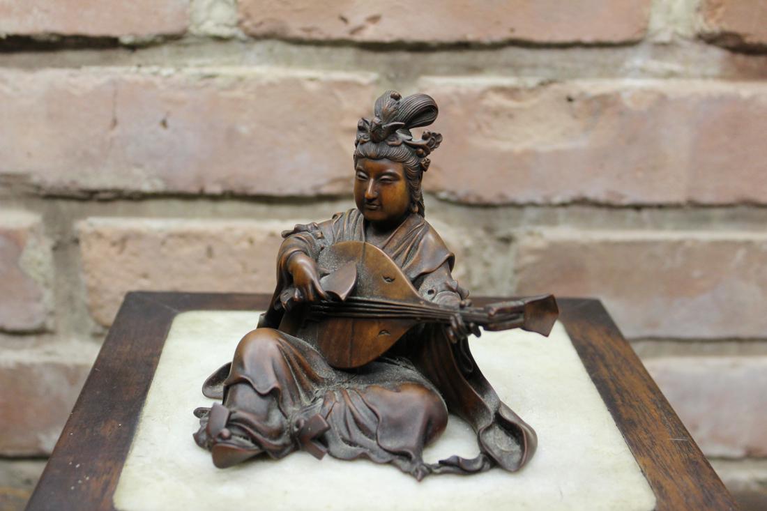 Japanese Boxwood Carving of a Musician: 19th cen, meiji period, signed by the artist, measures 4' in height, 5" in width; Provenace: from a New England Collection