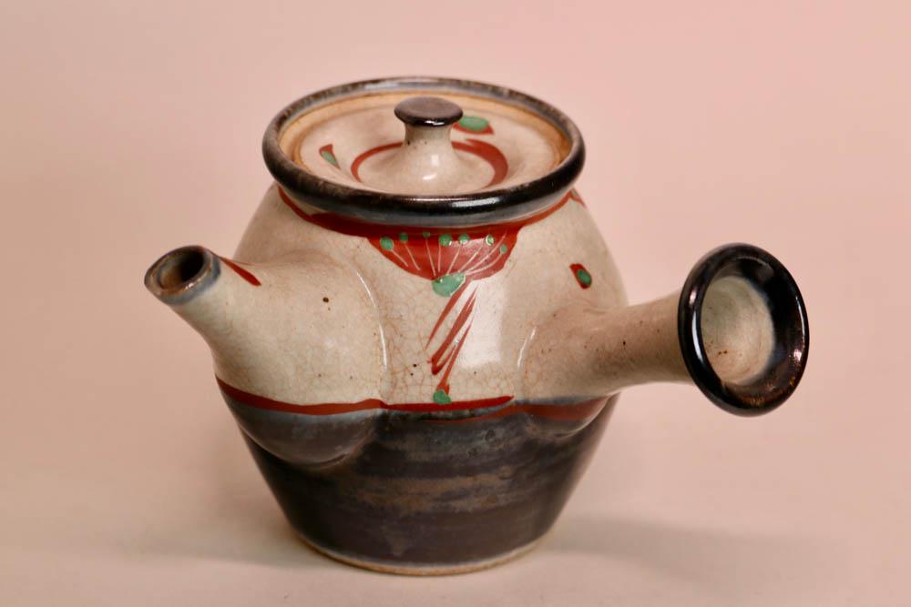 Japanese Studio Pottery Teapot: 20th cen, with side handle and red overglaze dÃ©cor, bottom with crackle glazed finish, measures 7"w 5.3"ht