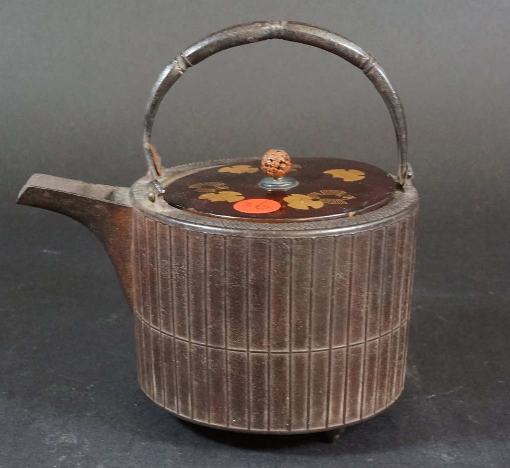 Japanese Iron Tetsubin Teapot: With overhand handle and lacquer wood cover, carved figural nut finial. Meiji period, 19th century.