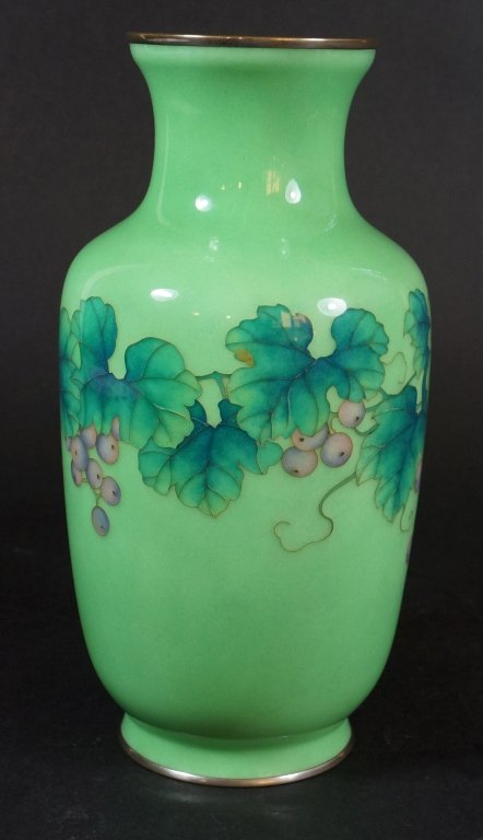Japanese Cloisonne Vase: Signed by Ando Jubai, grape vine motif on grass green ground. 20th century. Measures 9.75" in height.