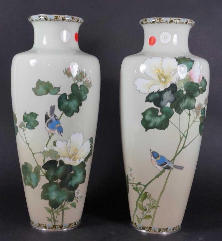 Pair of Japanese Imperial Cloisonne Vases: Floral and bird scene on soft cream background, neck with Japanese Imperial royal family crest, signed by Ando Jubei. Meiji period. Partial restoration. Measures 17" in height.