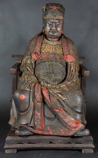 Chinese Lacquered Wood Guandi: Seated on chair with hands folded in robe, fully armored with dragon decoration. 16/17th century. Measures 20" in height.