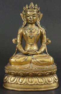 Tibetan Gilt Bronze Amitayus: Fully gilt with turquoise inserts on double lotus base. 17th century. Measures 8" in height.