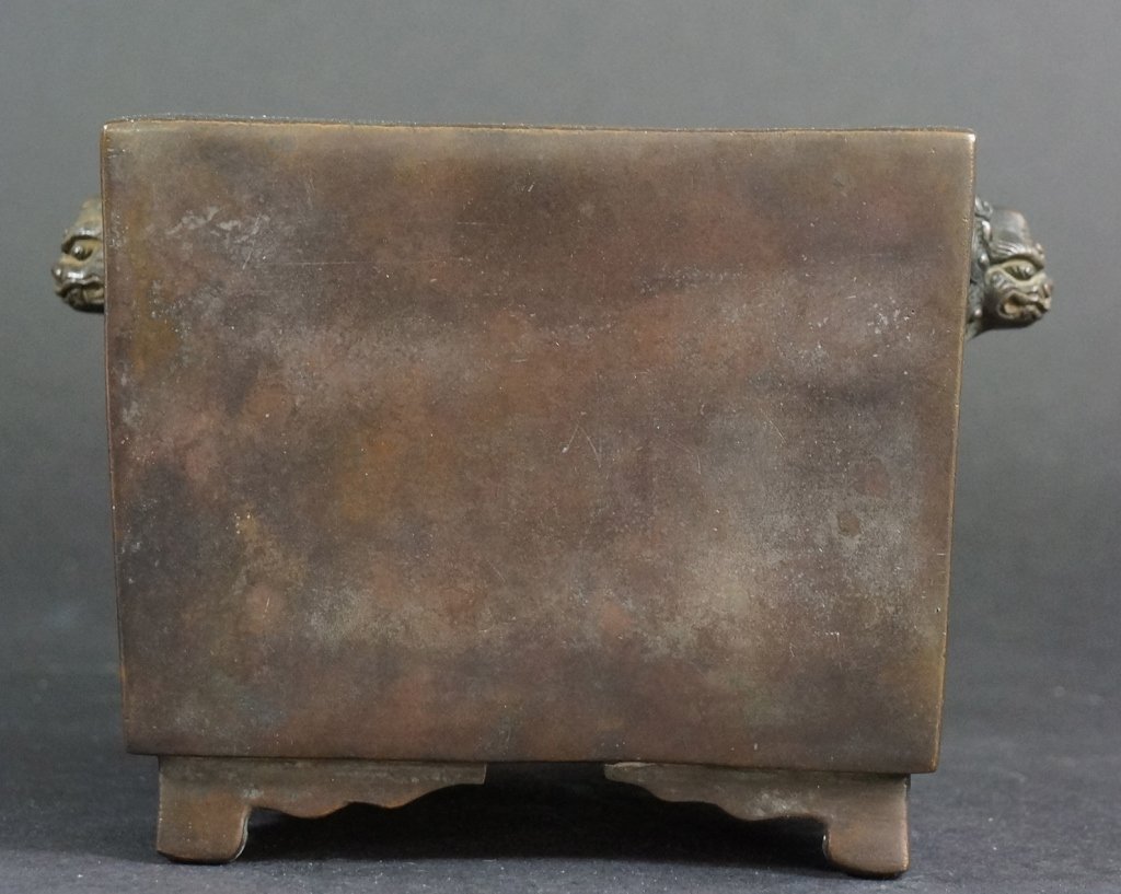 Chinese 18th Century Bronze Censer: Of square of form, two foolion mask on each side, Xuande mark. 18th century. Measures 6" in wide.
