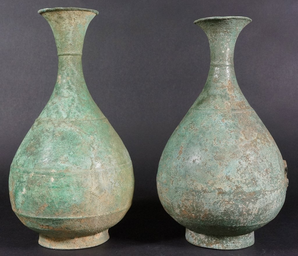 Pair of Chinese Han Dynasty Bronze Vases: Of long neck pear shaped. Measures 12" in height.