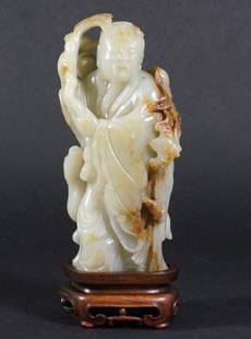 Fine Chinese Jade Figure of a Scholar: Of standing form with bats and animals on the side, various area of yellow skins add warm texture to the patina, with original rosewood base. 18th century, Cheulung (QianLong) period. 6" height for th