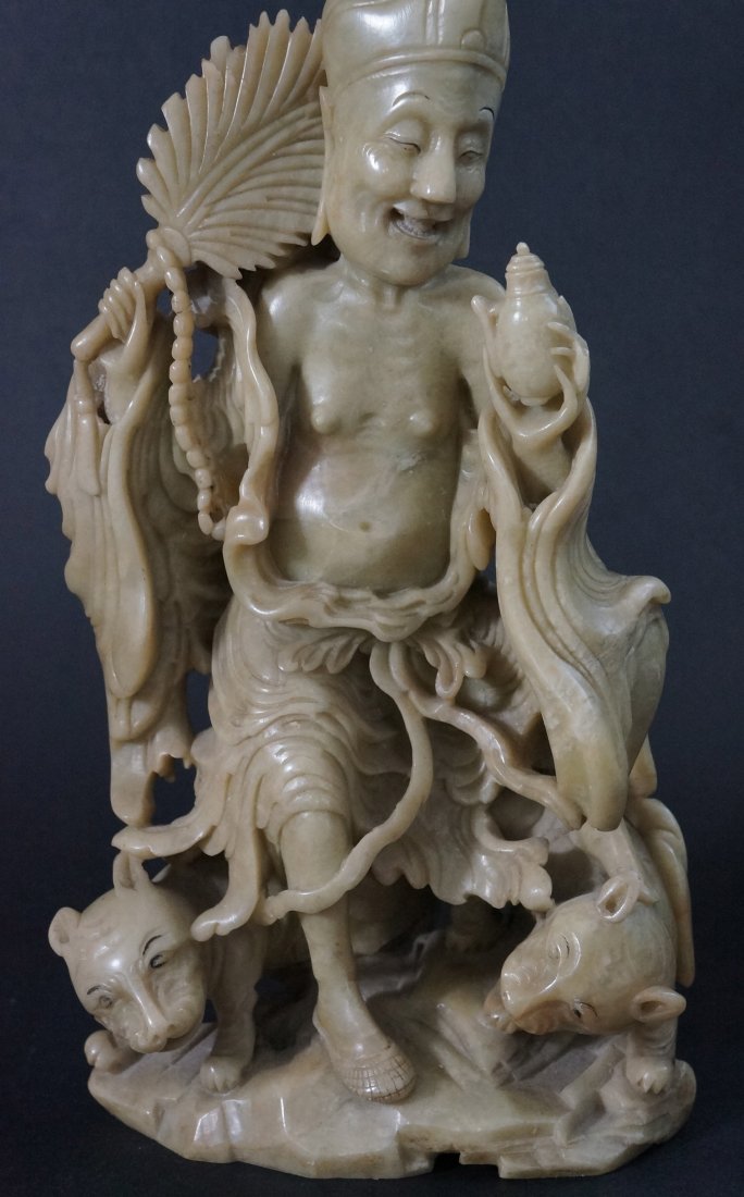 Chinese Soapstone Carving: Of an immortal with fan. 19th century. 10" H.