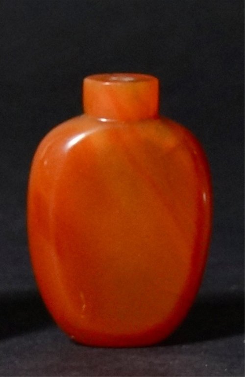 Chinese Agate Snuff Bottle: Of even carnelian color. 19th century. 2.5" H.