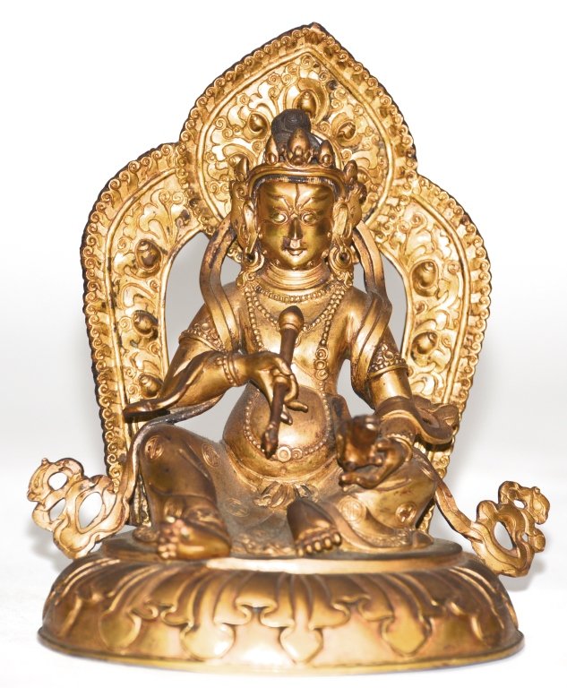 Nepalese Gilt Bronze Seated Buddha: 19/20th cen, Nepalese seated Buddha holding attributes in one hand, with wealth rat in the other hand, separate cast mandola at back. Measure 7"h