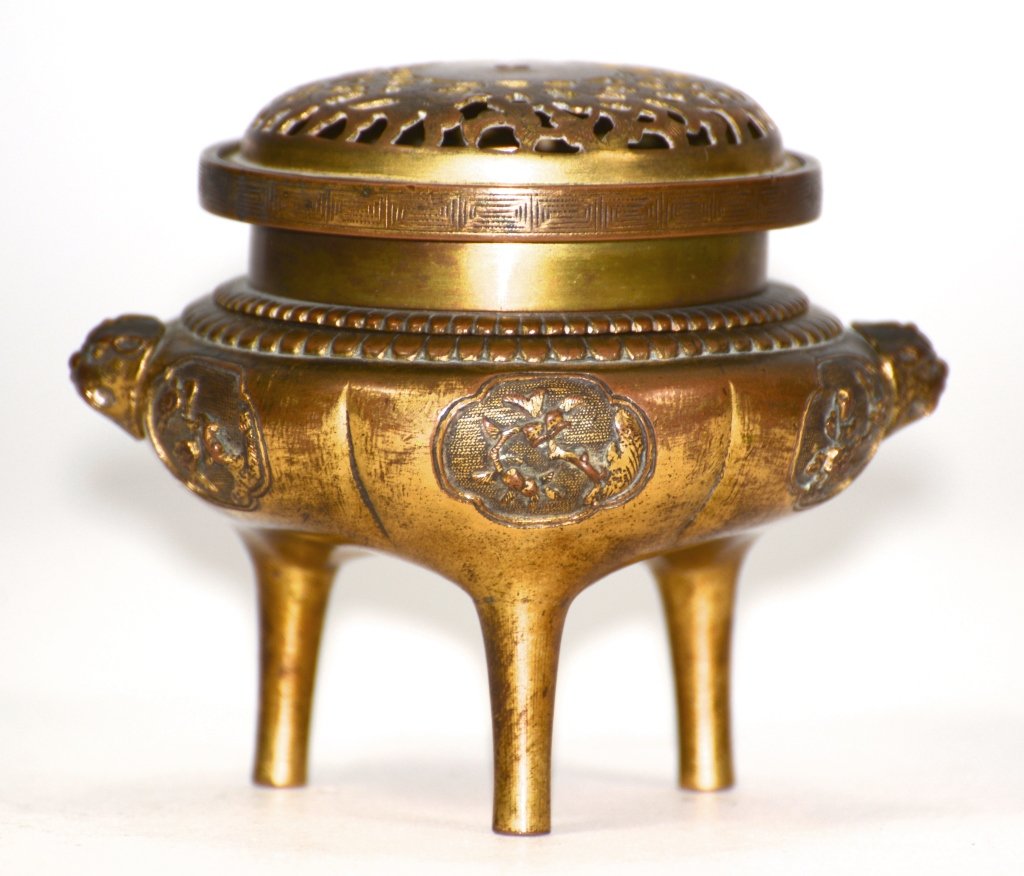 Chinese Gilt Bronze Censer: 17/18th cen Chinese bronze censer with foolion mask handle and bird floral motif. Measures 3.25"h. 4'dia